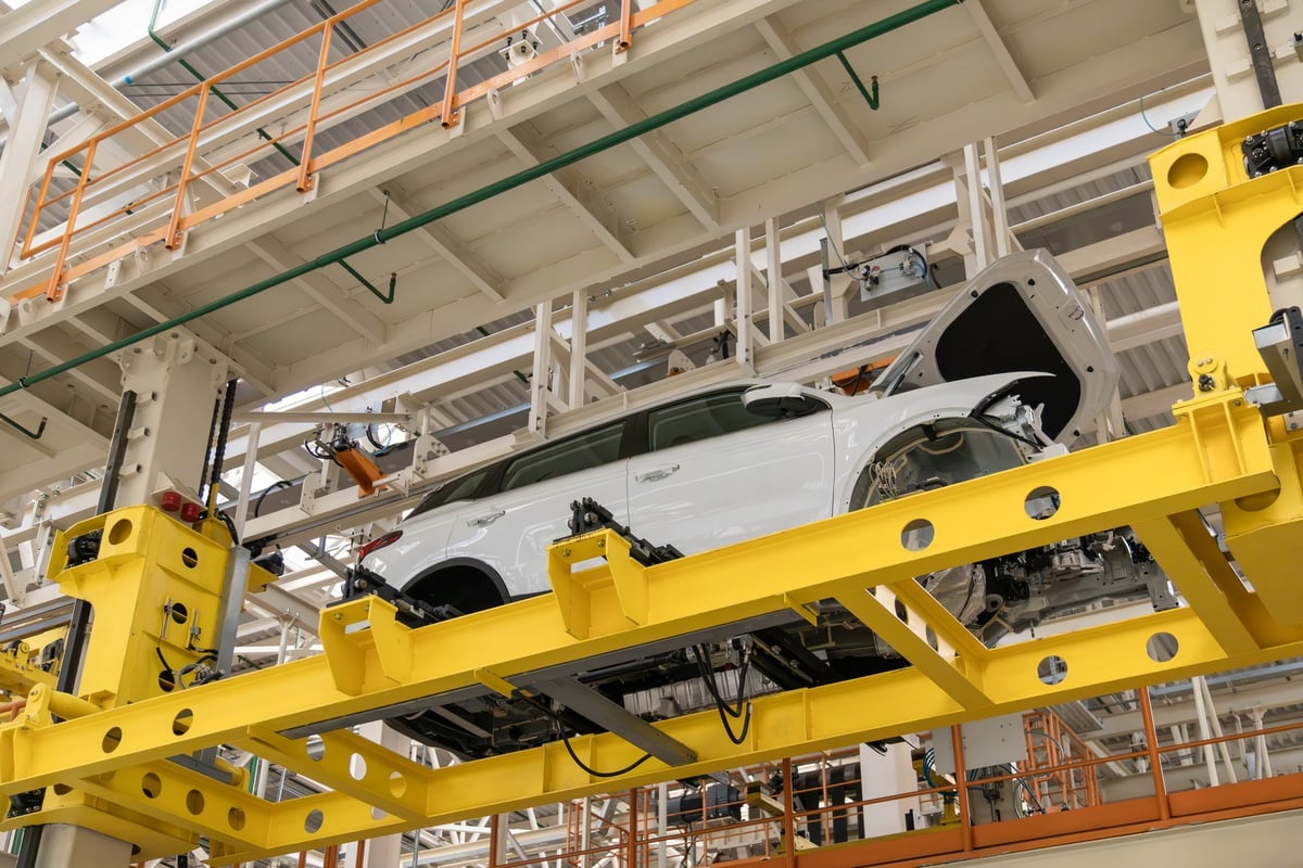 Modern automotive factory production line with car body on conveyor system